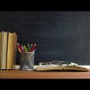 Image of books and pencils in a classroom