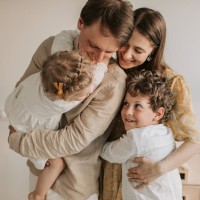 image of family hugging